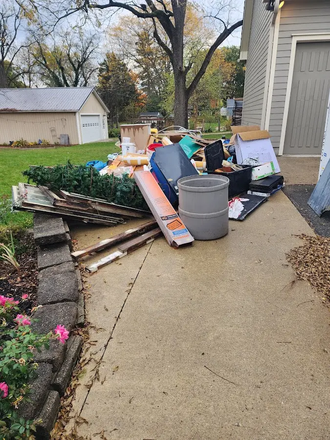 Dumpster being loaded with debris for Roofing Dumpster Rental in Orinda